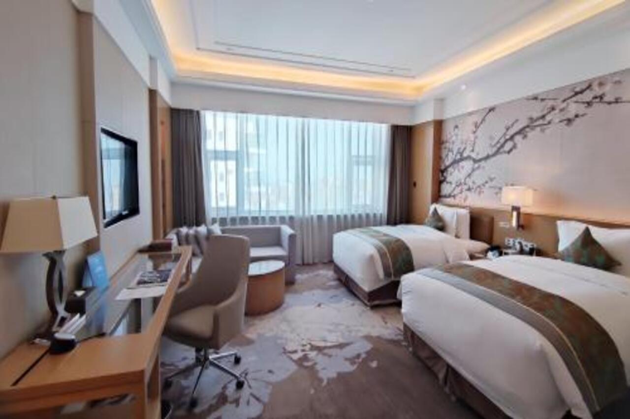 Hotel Howard Johnson Xiangyu Plaza Linyi à Linyi  Extérieur photo