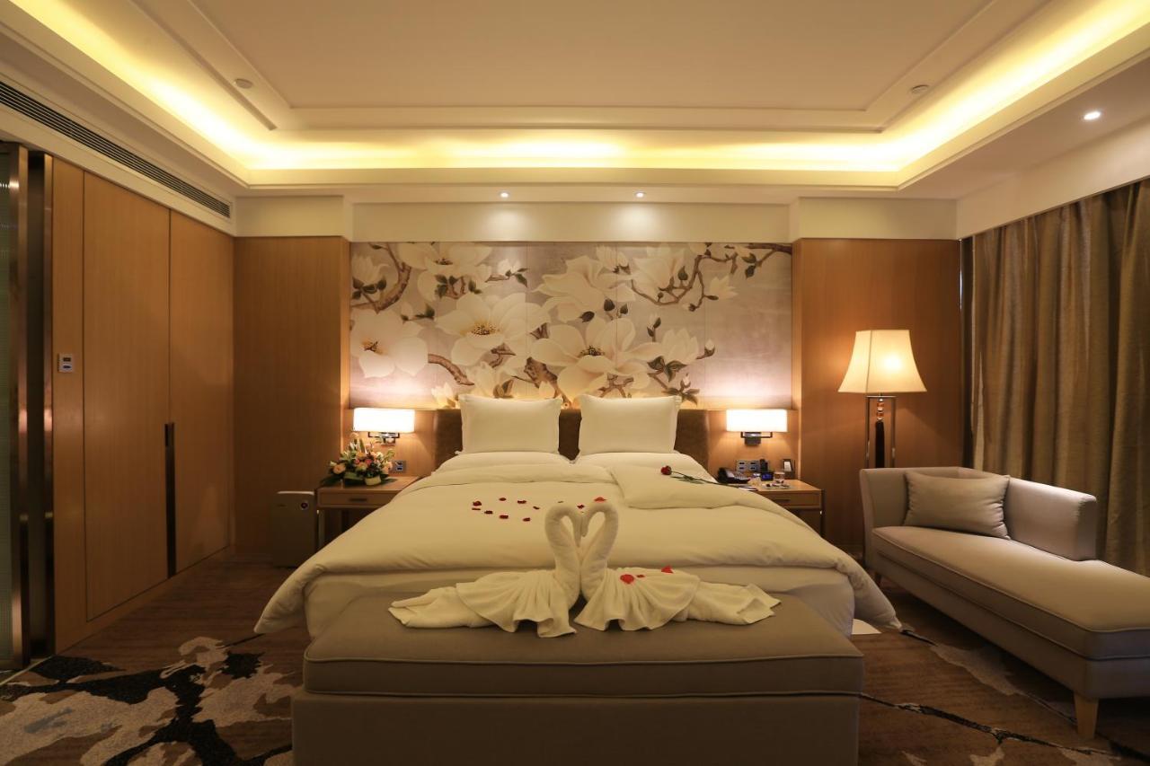 Hotel Howard Johnson Xiangyu Plaza Linyi à Linyi  Extérieur photo