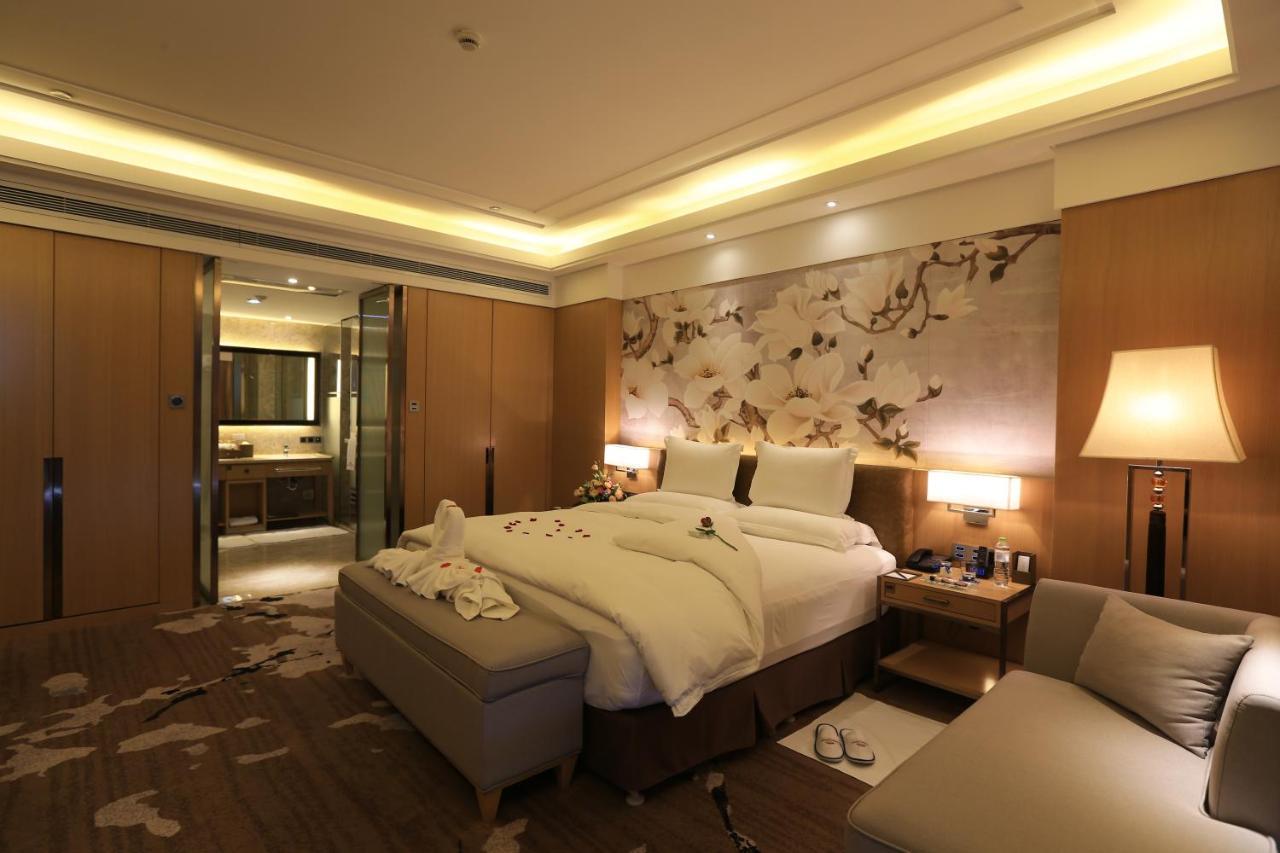 Hotel Howard Johnson Xiangyu Plaza Linyi à Linyi  Extérieur photo