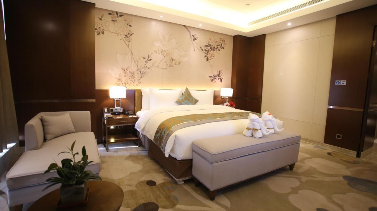 Hotel Howard Johnson Xiangyu Plaza Linyi à Linyi  Extérieur photo